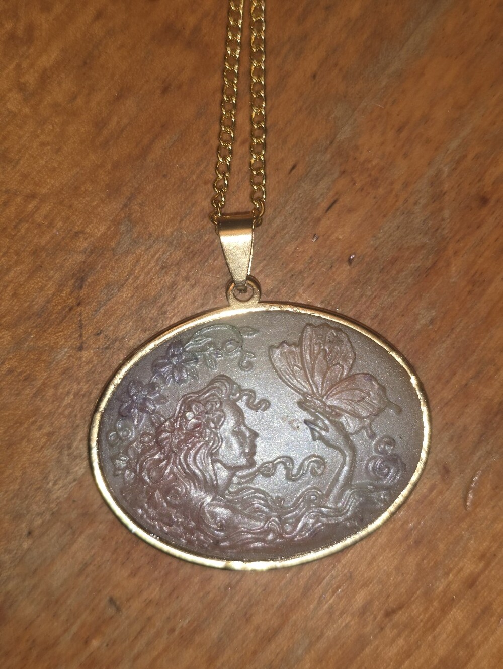Ladies Head Cameo Touching Butterflies In A Gold Frame. Stainless Steel Necklace